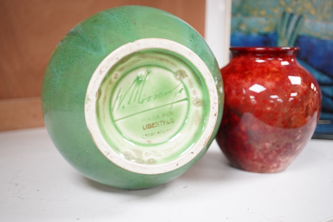 A Moorcroft for Liberty & Co. Flamminion Ware vase, and a smaller Moorcroft vase glazed in a mottled plum flambe, the first 20cm., also to include two Moorcroft reference books